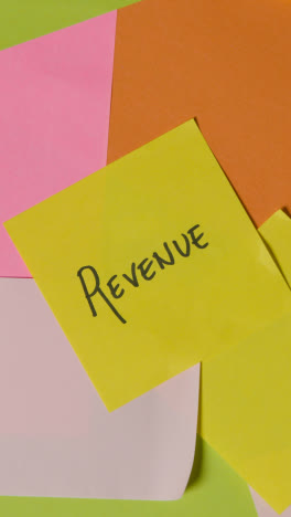 Vertical-Video-Business-Concept-Of-Revolving-Sticky-Notes-With-Revenue-Written-On-Top-Note-1